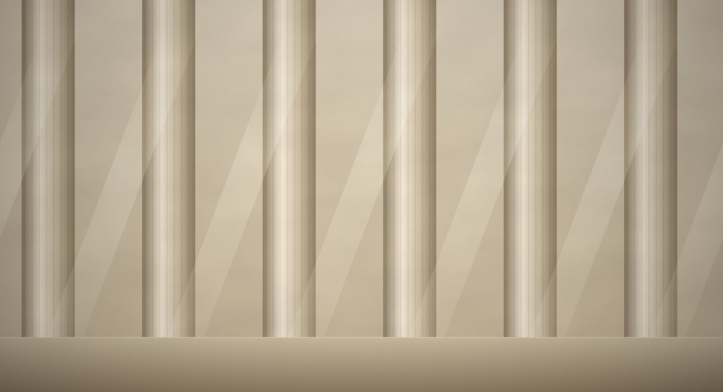 Sunlight falling in diagonal shafts across a row of fluted stone columns.