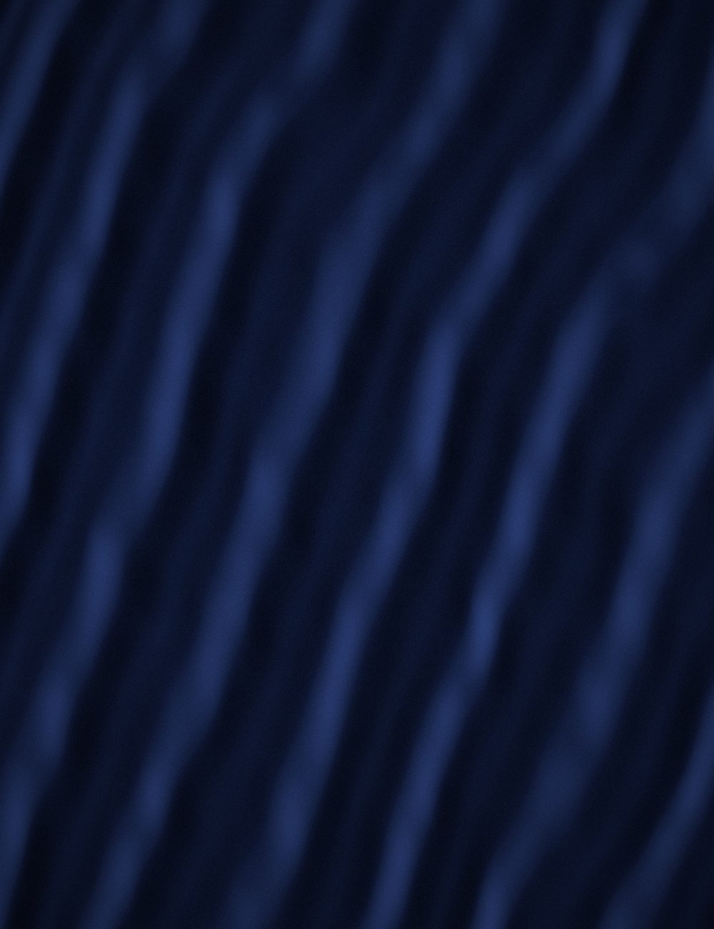 Midnight-blue velvet falling in deep folds.